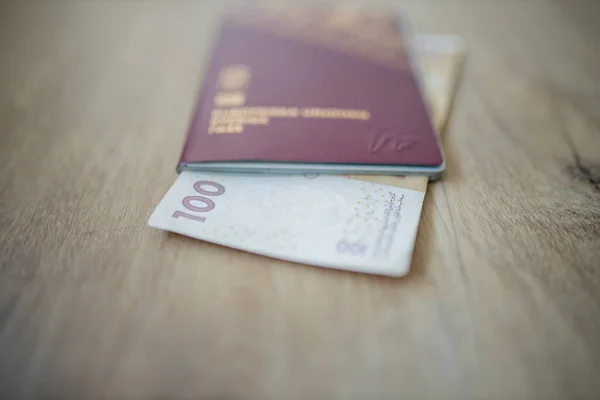 100 Moroccan Dirhams Bill Partially Inside a Sweden Passport — Stockfoto