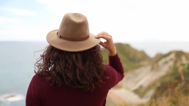 Woman Enjoying the View of the Jurassic Coast During a Windy Day — ストック動画