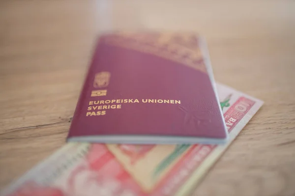 European Union, Sweden Passport with a Ten Quetzales Bill Inside — Fotografia de Stock