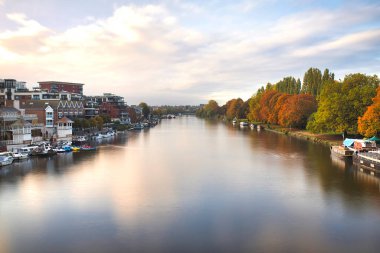 Aerial Landscape View Over a River between a Town and a Forest