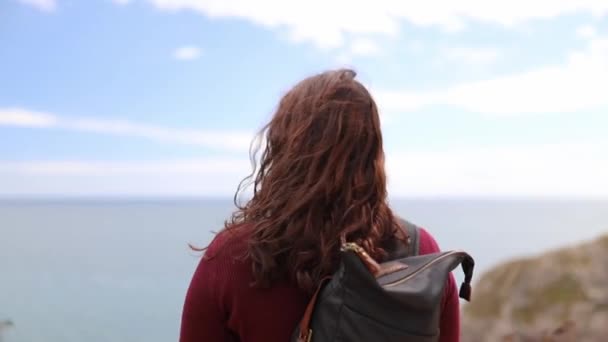 Woman Enjoying the View of the Jurassic Coast During a Windy Day — Stock Video