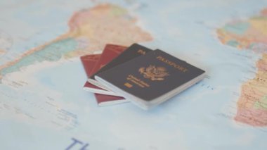 United States of America and Sweden Passports on a Colorful World Map