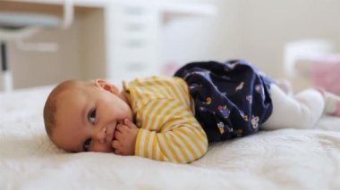 Mother Comes Down to Hug and Kiss her Happy Baby Daughter