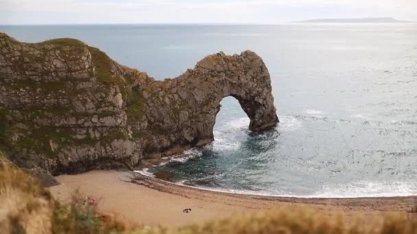 Astonishing View of The Durdle Door on a Cloudy and Windy Day — Wideo stockowe
