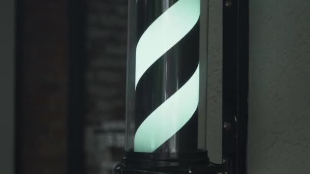 Traditional Black and White Barber Pole Light Outside a Barbershop — Stock Video