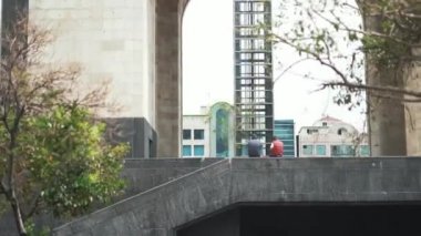 Tourists Resting Next to the Monument to the Revolution From Mexico City