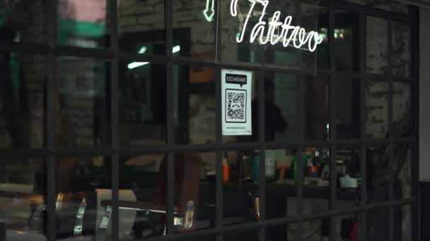 Blue Tattoo Light Sign and a QR Code that Says Scan Me on a Window — Video Stock