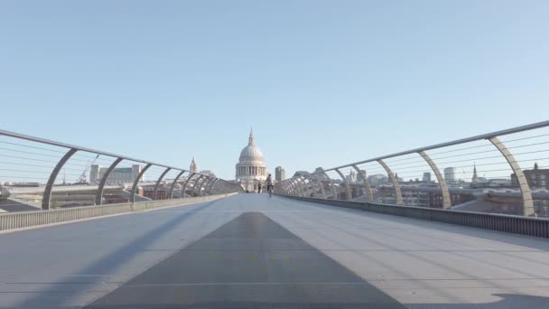 St Pauls Cathedral from Millennium Bridge with a Man Passing By — Αρχείο Βίντεο