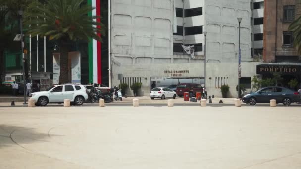 Vehicles Driving Around the Republic Square with Buildings in the Background — Wideo stockowe