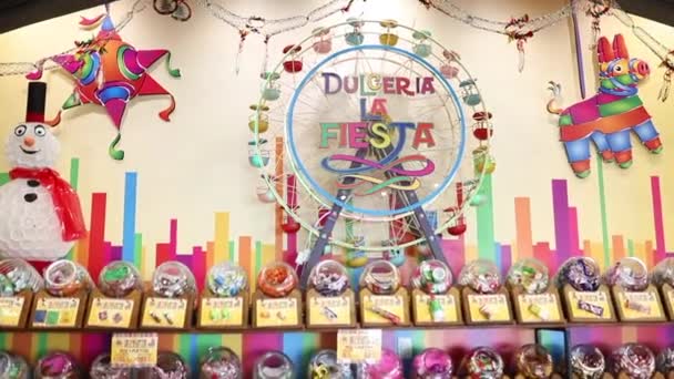View Spinning Around Candy Ferris Wheel in a Mexican Store — Stock Video