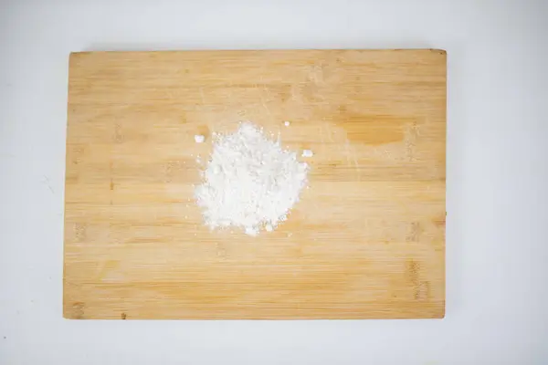 Small pile of flour on a cutting board — Stock Photo, Image