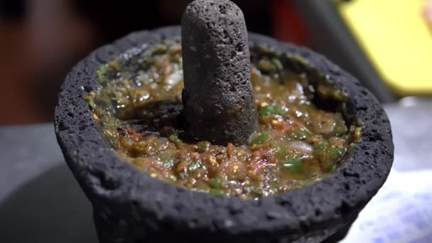 Close-up of traditional Mexican molcajete full of sauce — Stok Video