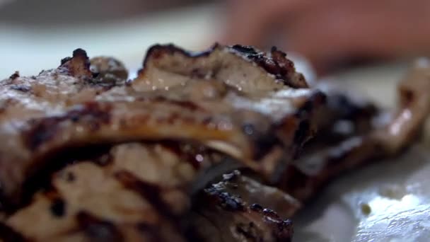 Cook hands slowly slicing a piece of meat — Stock Video