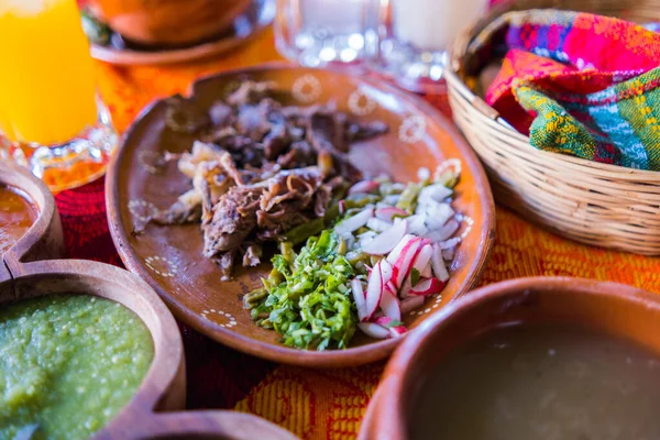 Mexican chopped lamb meat, condiments, and two jars of refreshing drink — Stock Photo, Image