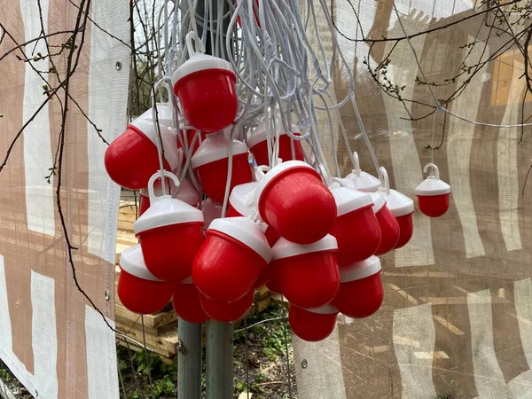 Close-up of red warning lights with street barriers at a construction site. Red warning signal light. Ensuring safety near the construction site, fencing construction work