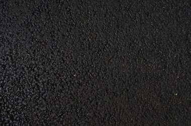 Siyah doku, asfalt yüzey ziftinin pürüzü, asfalt rengi gri yol, garaj yolu arka planı.