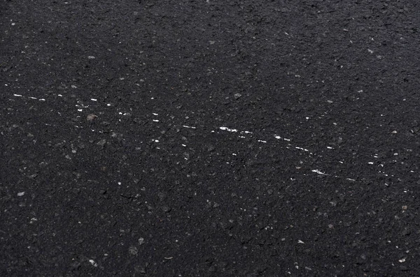 Small Splashes of white paint on asphalt good as background pattern — Stock Photo, Image