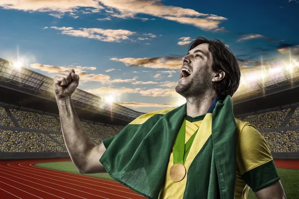 Atleta Celebrando una medalla de oro — Foto de Stock