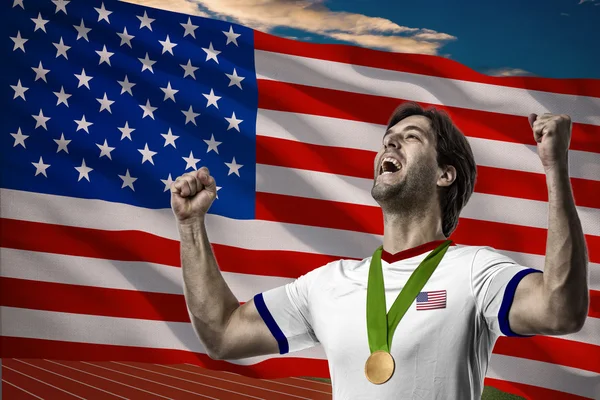 Atleta Celebrando uma medalha de ouro — Fotografia de Stock