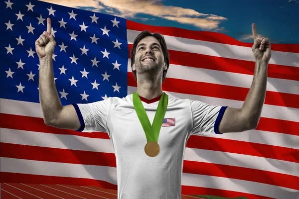 Athlet feiert Goldmedaille — Stockfoto
