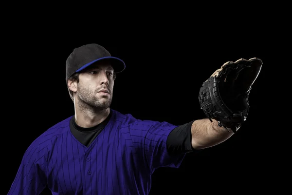 Jogador de beisebol com um uniforme azul — Fotografia de Stock