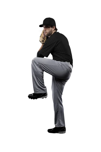 Sürahi beyzbol oyuncusu siyah üniforma ile — Stok fotoğraf