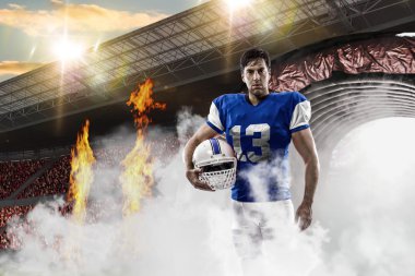 Futbolcu mavi bir üniforma ile