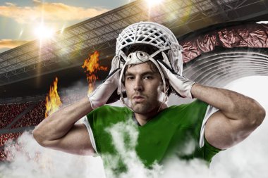 Futbolcu yeşil üniforma ile