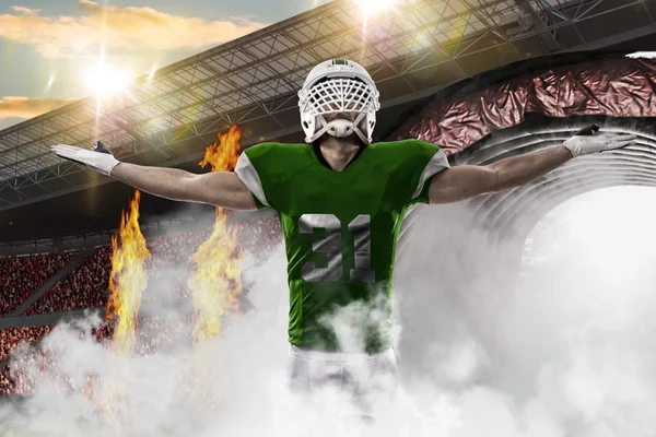 Football Player with a green uniform — Stock Photo, Image