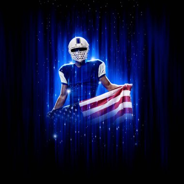 Süper kahraman pozu veren futbolcu siyah arka planda mavi ışıklarla mavi üniforma giyiyor..