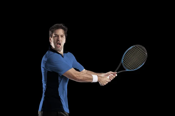 Jogador de tênis com uma camisa azul . — Fotografia de Stock