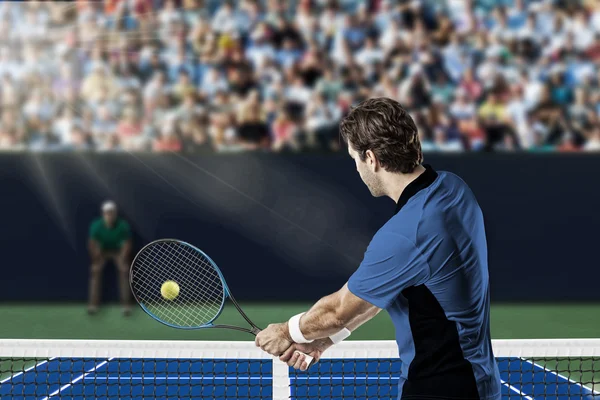 Tennis player with a blue shirt. — Stock Photo, Image