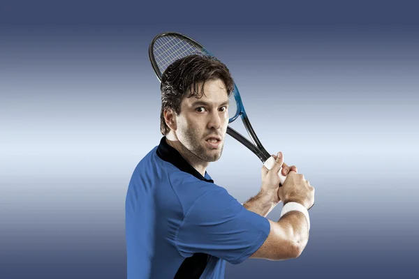 Tennis player with a blue shirt. — Stock Photo, Image