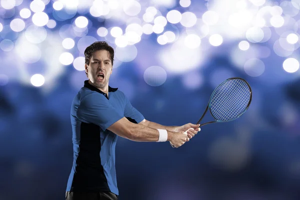 Tennis player with a blue shirt. — Stock Photo, Image