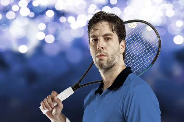 Tennis player with a blue shirt. — Stock Photo, Image