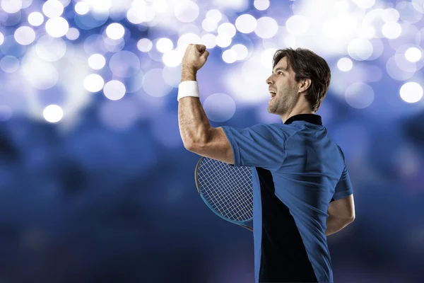 Tennis player with a blue shirt. — Stock Photo, Image