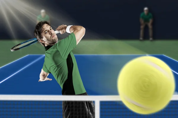 Tennis player with a green shirt. — Stock Photo, Image