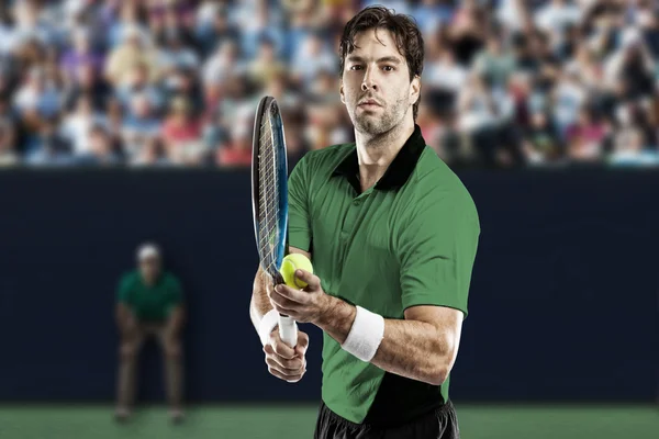 Tennis player with a green shirt. — Stock Photo, Image