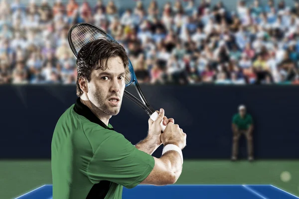 Tennis player with a green shirt.