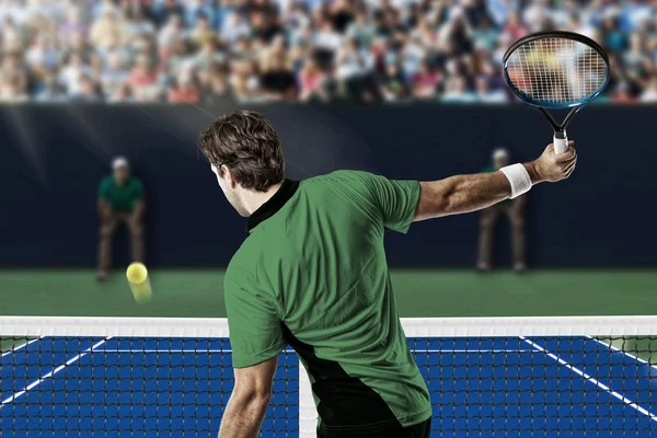 Tennisspeler met een groen shirt. — Stockfoto