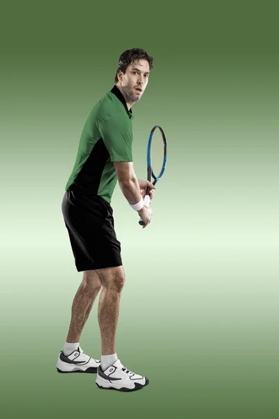 Jogador de tênis com uma camisa verde . — Fotografia de Stock