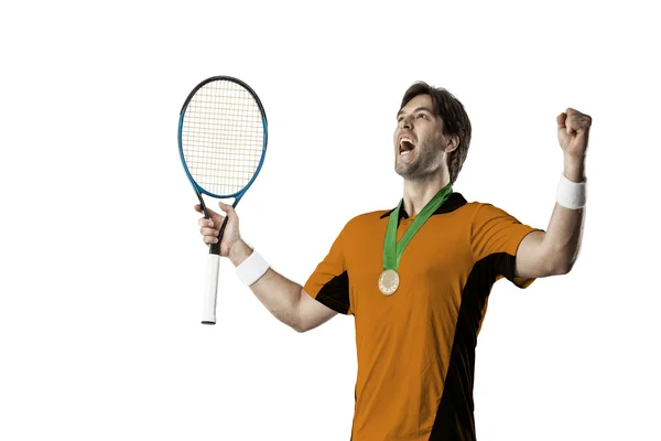 Jogador de tênis com uma camisa laranja . — Fotografia de Stock