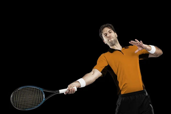 Tennisspelare med en orange skjorta. — Stockfoto
