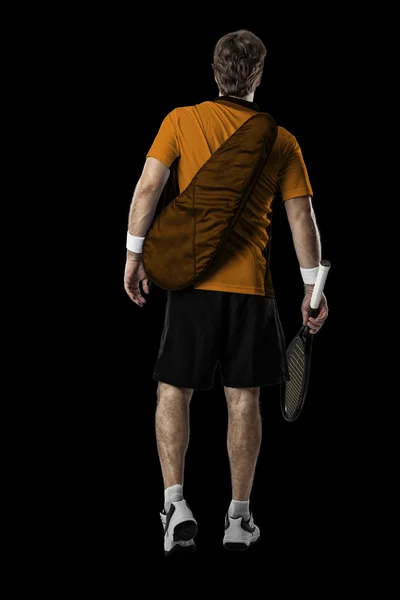 Jogador de tênis com uma camisa laranja . — Fotografia de Stock