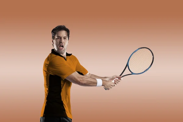 Tennisspeler met een oranje shirt. — Stockfoto