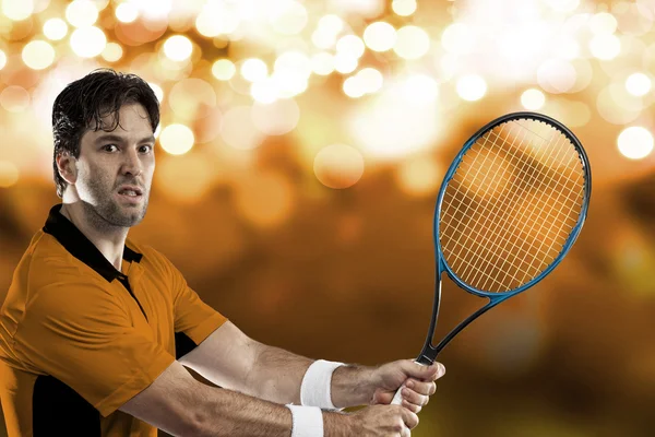 Tennis player with a orange shirt. — Stock Photo, Image