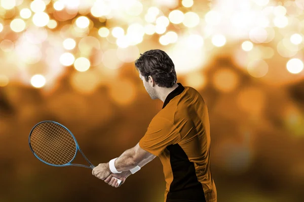 Tennisspelare med en orange skjorta. — Stockfoto