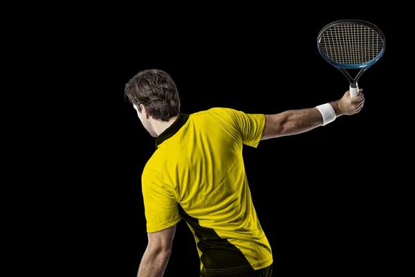 Tenisista z żółtą koszulkę. — Zdjęcie stockowe