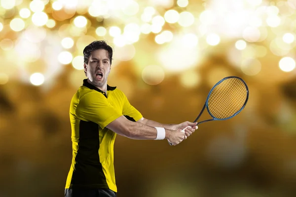 Tennis player with a yellow shirt. — Stock Photo, Image