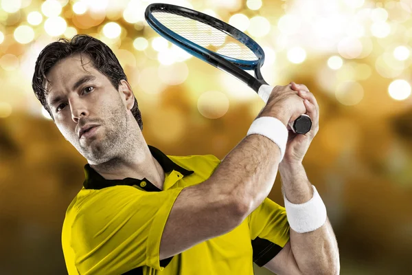 Tennis player with a yellow shirt. — Stock Photo, Image